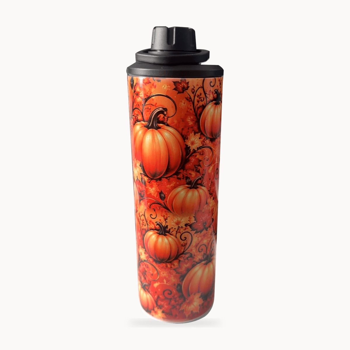 Autumn pumpkin tumbler with orange pumpkins, fall leaves and a black lid